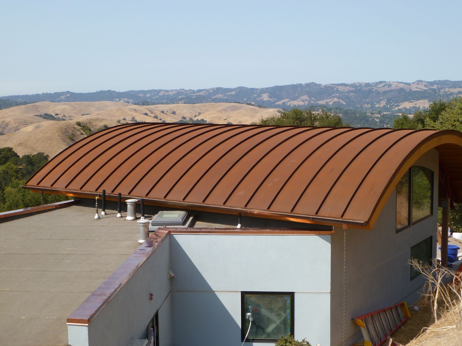corten standing seam curved metal roof