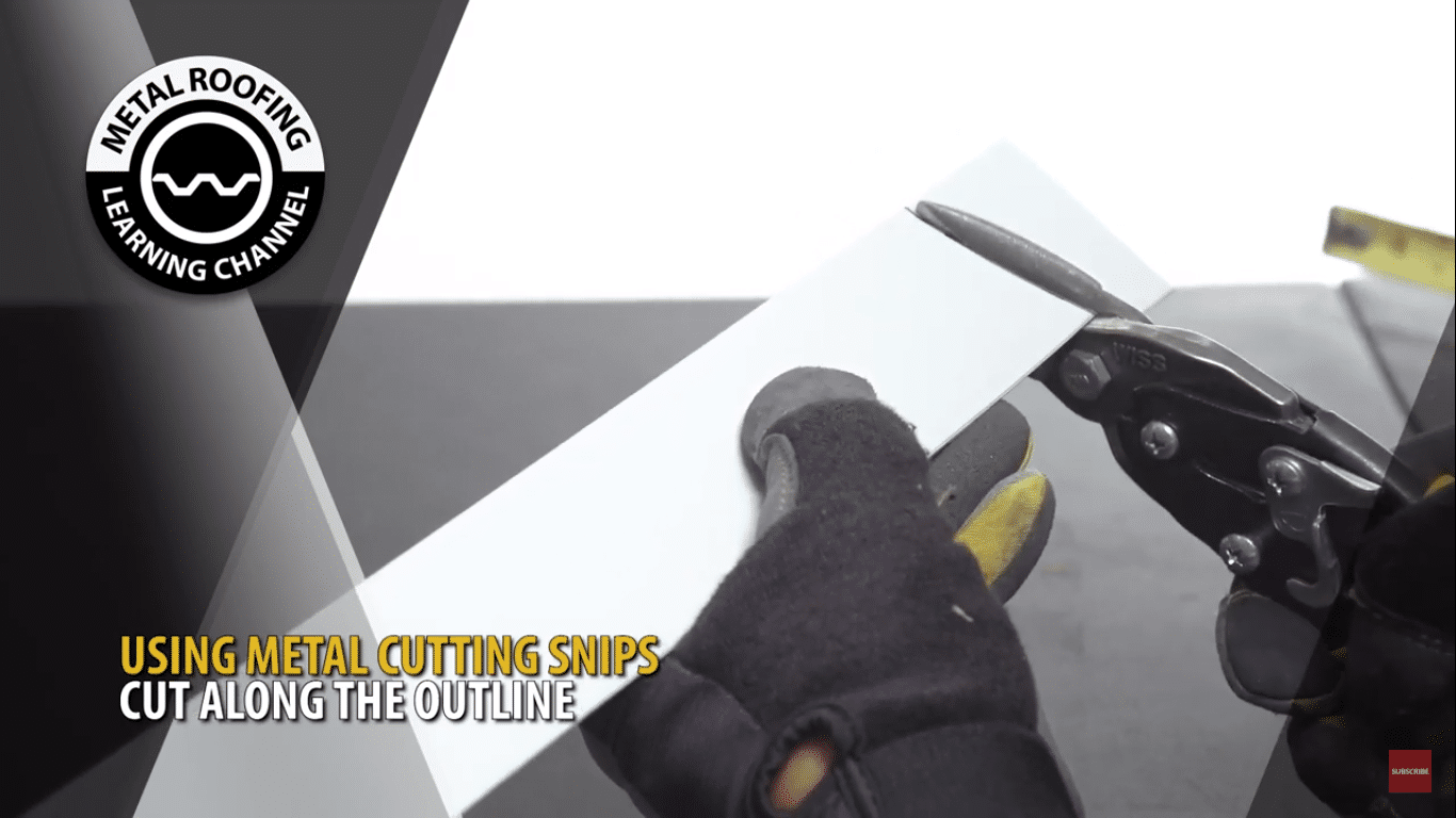 Using metal cutting snips cut along the outline